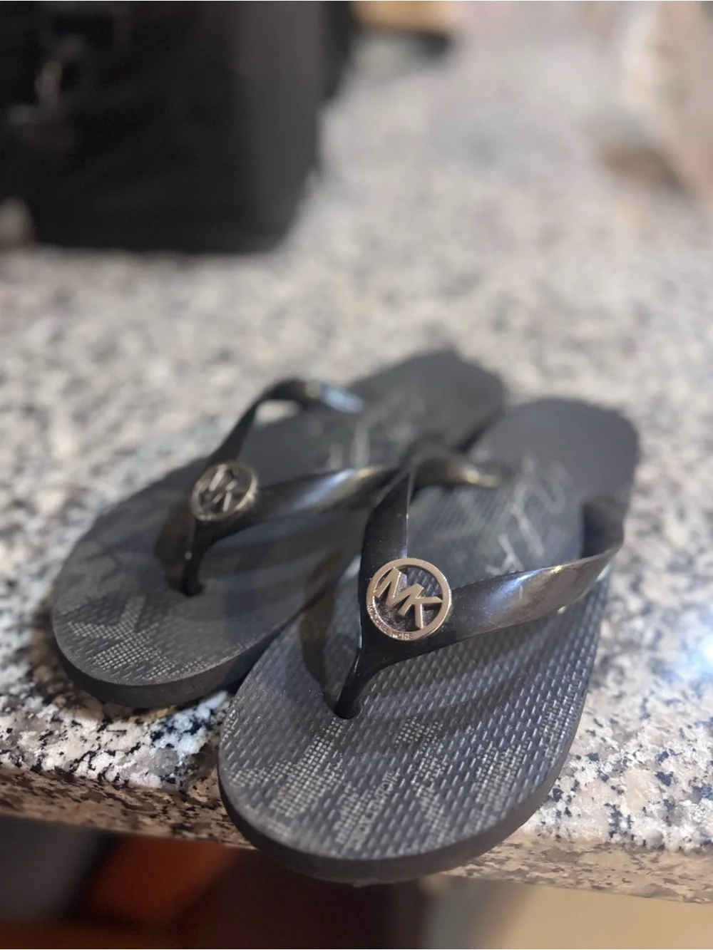 Michael Kors Black Jelly Flip Flops with Gold MK Medallion